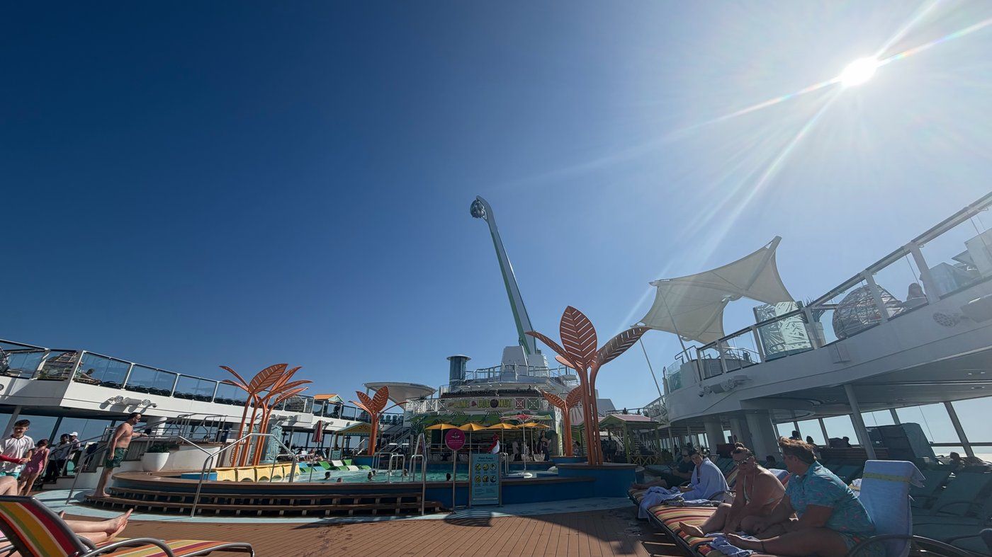 The pool deck aboard Odyssey of the Seas in bright sun