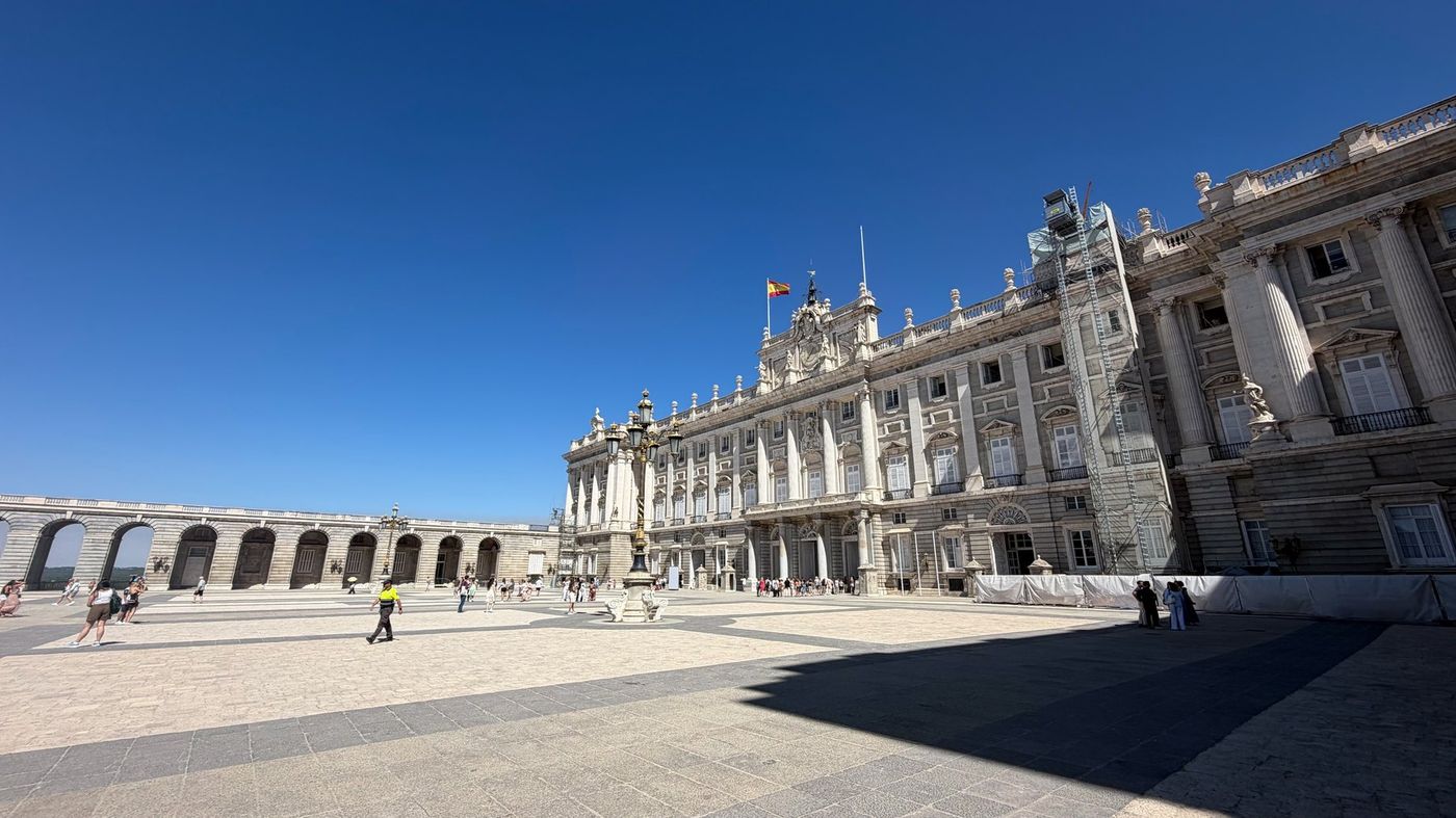 Grand historic buildings beneath a blue Madrid sky