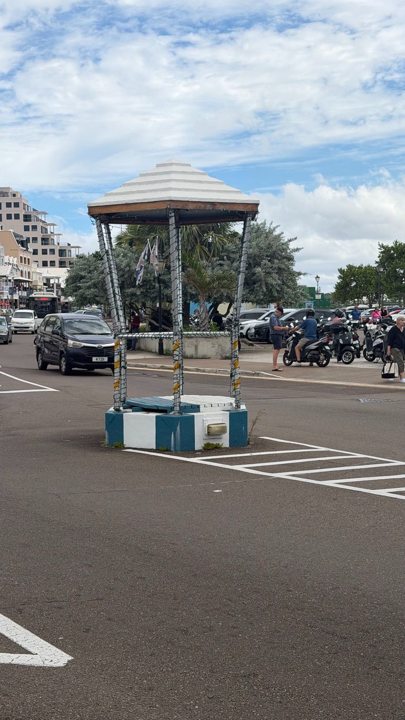 A traditional Bermuda moongate-style shelter on a Hamilton street